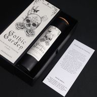 Gothic Garden ritual spell card beside the candle