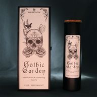 Gothic Garden ritual candle displayed with its illustrated packaging