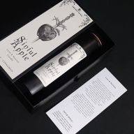 Sinful Apple ritual spell card beside the candle