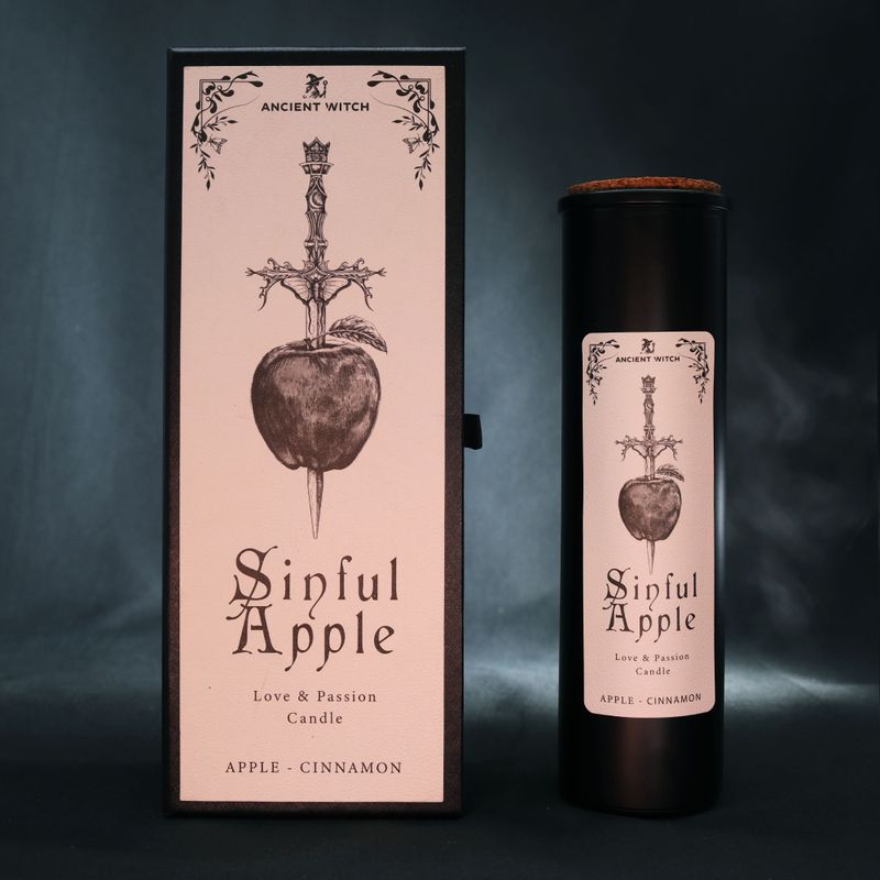 Sinful Apple ritual candle displayed with its illustrated packaging